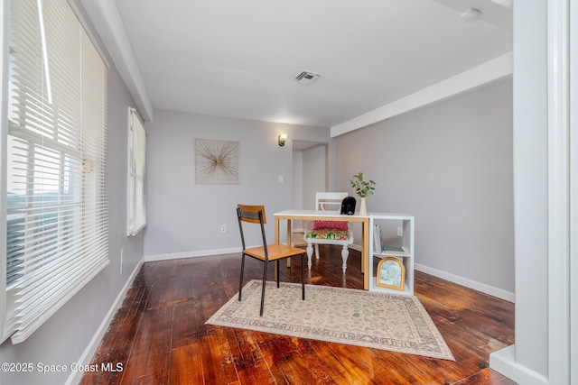 dining space featuring dark wood-type flooring