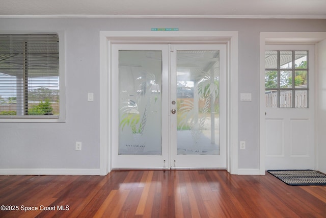 doorway with dark wood-type flooring