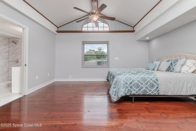 bedroom featuring ceiling fan, dark hardwood / wood-style floors, and lofted ceiling