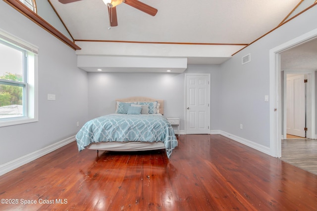 bedroom featuring ceiling fan, wood-type flooring, and lofted ceiling