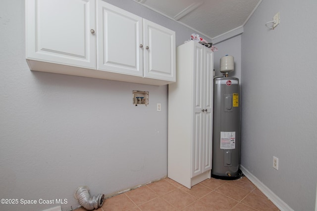 laundry area with light tile patterned floors, electric water heater, and washer hookup