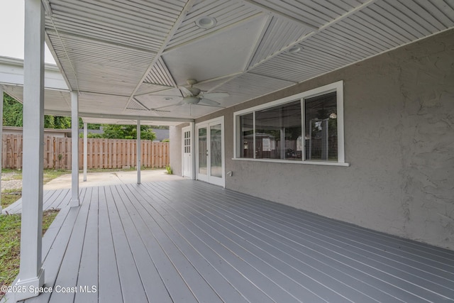 wooden deck featuring ceiling fan