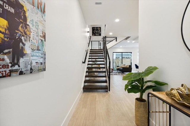 corridor featuring light hardwood / wood-style floors