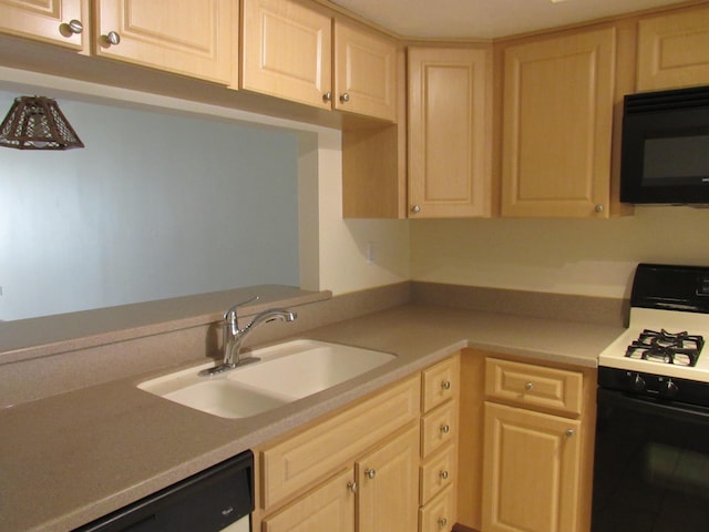 kitchen featuring light brown cabinetry, dishwashing machine, sink, and white gas range oven