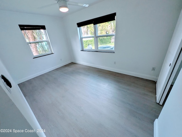 spare room featuring hardwood / wood-style floors and ceiling fan