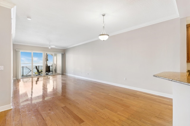 unfurnished living room with ceiling fan, light hardwood / wood-style flooring, and crown molding