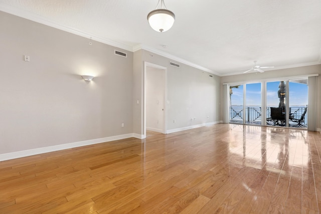 unfurnished living room with light wood-type flooring, ceiling fan, and crown molding