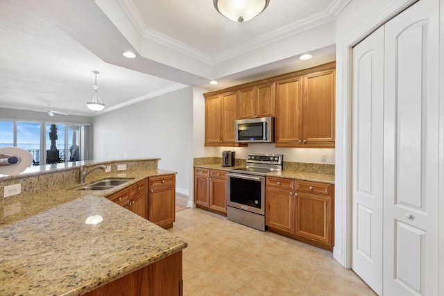 kitchen featuring appliances with stainless steel finishes, decorative light fixtures, light stone countertops, and sink