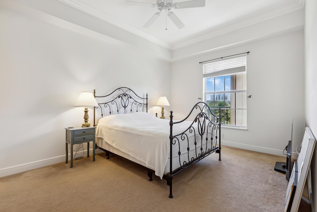 carpeted bedroom with ceiling fan and crown molding