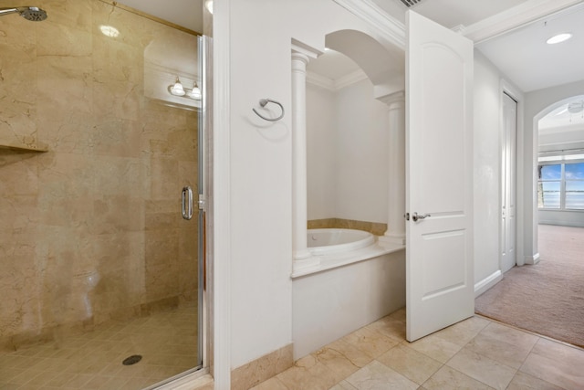 bathroom featuring decorative columns, plus walk in shower, and crown molding