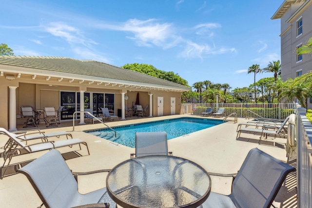 view of swimming pool with a patio area