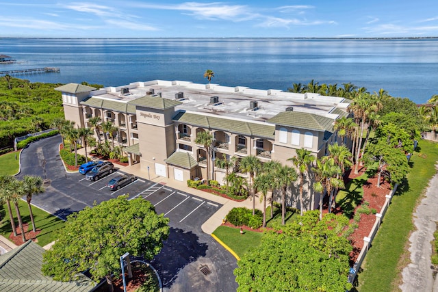 birds eye view of property with a water view