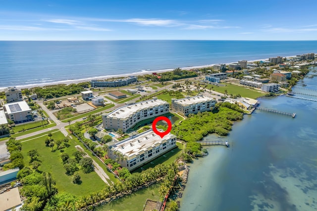 drone / aerial view with a view of the beach and a water view