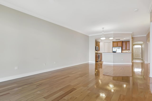 unfurnished living room with light hardwood / wood-style floors and crown molding