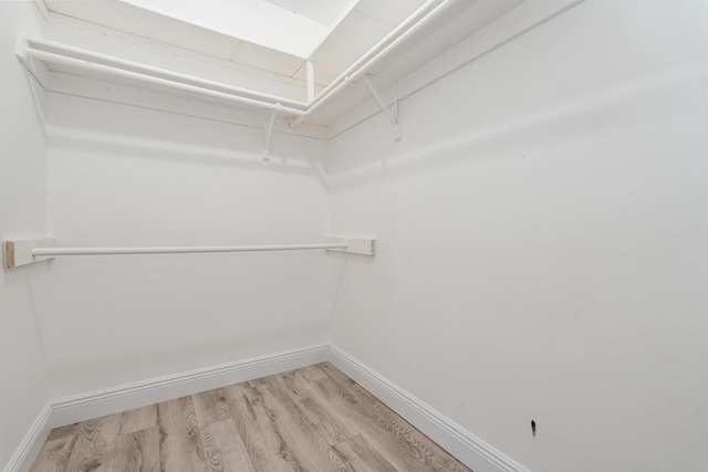 walk in closet featuring hardwood / wood-style floors