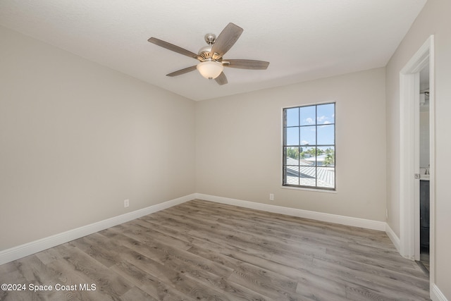 unfurnished room featuring ceiling fan and light hardwood / wood-style flooring