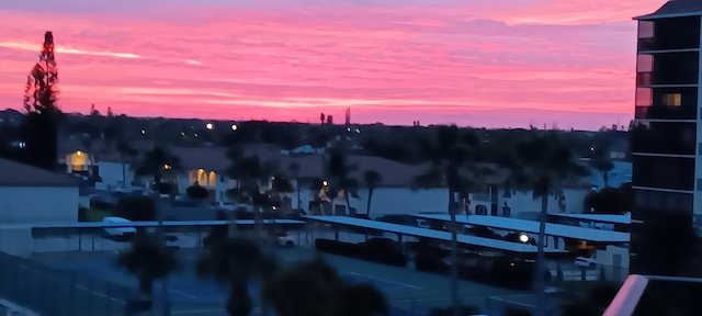 view of pool at dusk