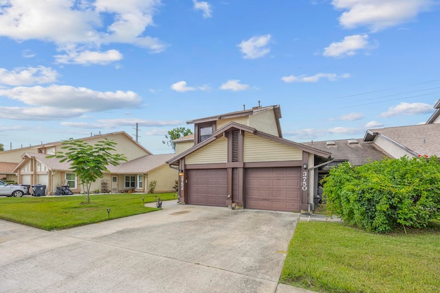 view of front of house with a garage and a front yard