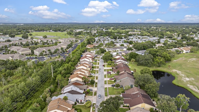 birds eye view of property featuring a water view and a residential view