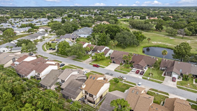 birds eye view of property with a water view and a residential view