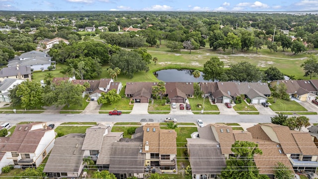 aerial view featuring view of golf course, a water view, and a residential view