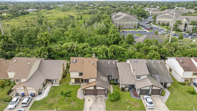 birds eye view of property with a residential view