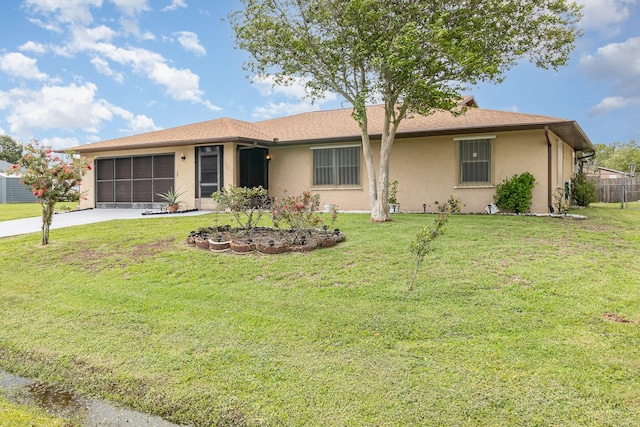 ranch-style home featuring a garage and a front yard