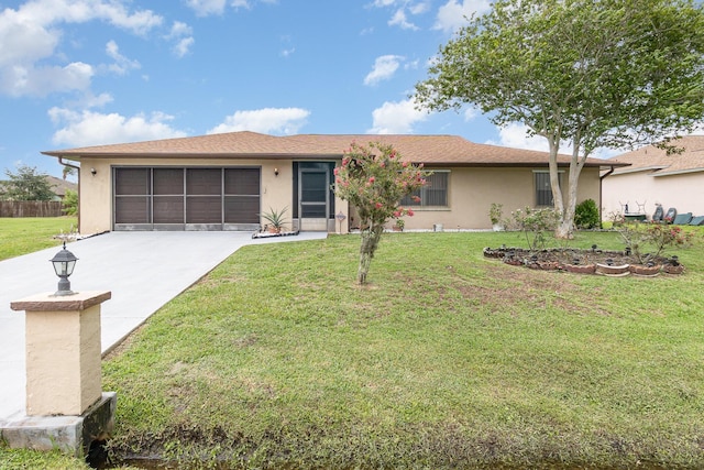 single story home with a garage and a front lawn