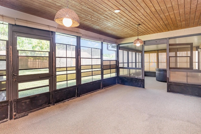 unfurnished sunroom with wood ceiling