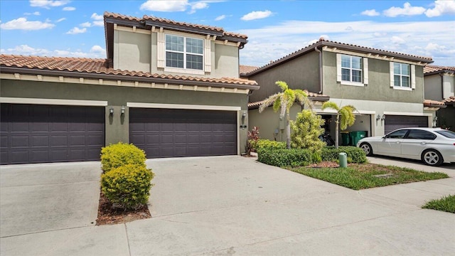 mediterranean / spanish house with a garage