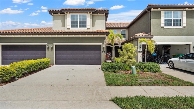 mediterranean / spanish-style home featuring a garage