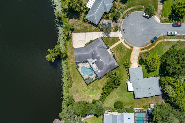 birds eye view of property with a water view