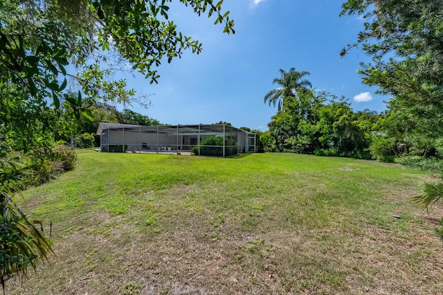 view of yard featuring a lanai