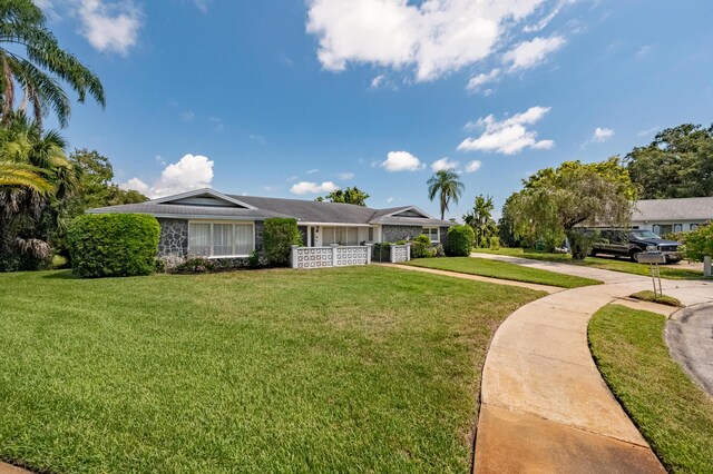 ranch-style house with a front yard