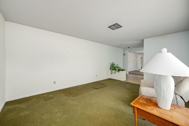 interior space featuring carpet, visible vents, and baseboards