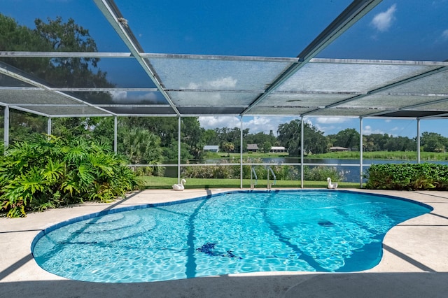 pool featuring a lanai, a patio, and a water view