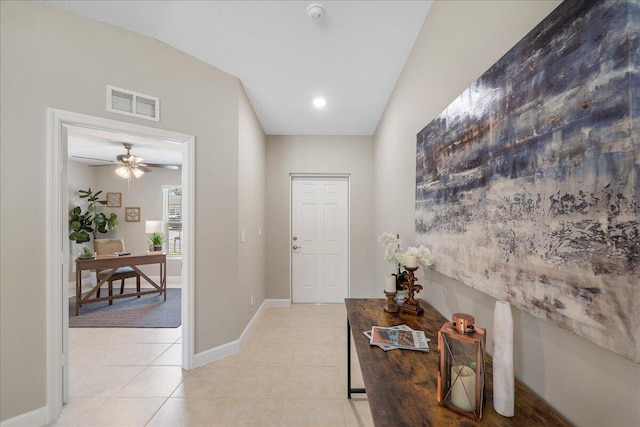 corridor featuring light tile patterned floors