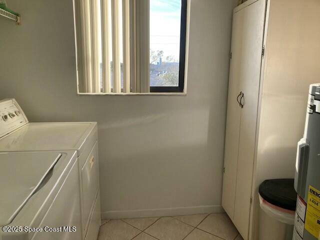 washroom featuring separate washer and dryer and light tile patterned floors