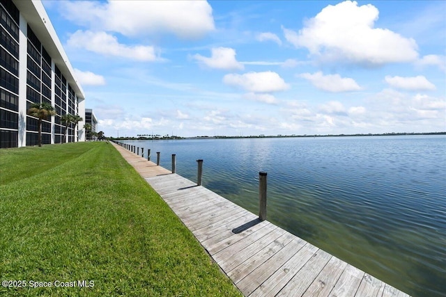 250 S Sykes Creek Pkwy Unit 309, Merritt Island, FL 32952 - dock with a lawn and a water view