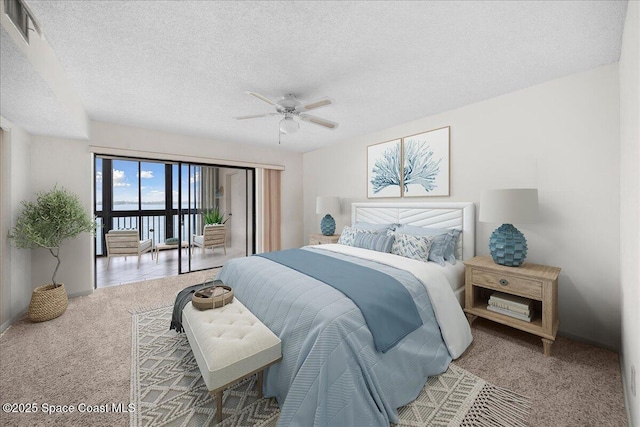 250 S Sykes Creek Pkwy Unit 309, Merritt Island, FL 32952 - carpeted bedroom featuring a textured ceiling and a ceiling fan