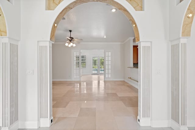 hall with crown molding and french doors