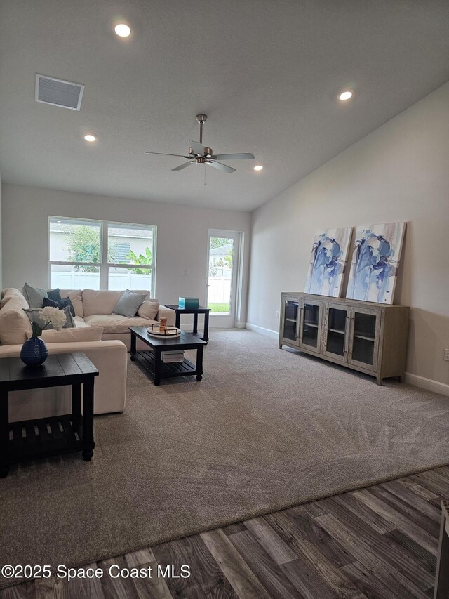 920 Lyons Cir NW, Palm Bay, FL 32907 - living room with baseboards, recessed lighting, a ceiling fan, carpet floors, and wood finished floors