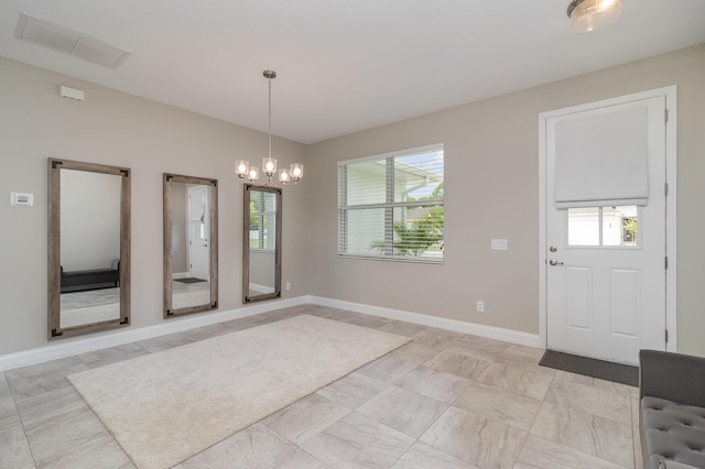 unfurnished dining area featuring a notable chandelier and plenty of natural light