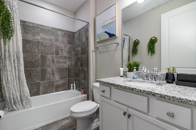 bathroom featuring shower / bath combo, vanity, toilet, and tile patterned floors