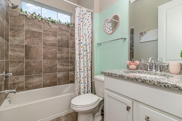 bathroom with shower / bath combo, vanity, and toilet