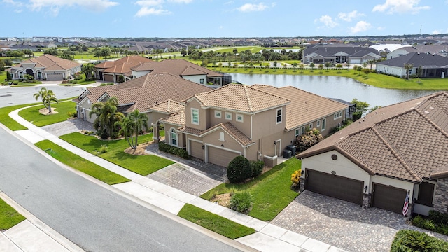 aerial view with a residential view and a water view