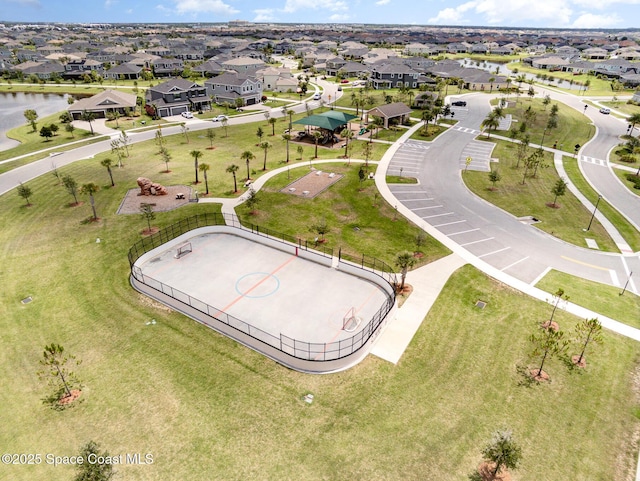 bird's eye view with a residential view and a water view