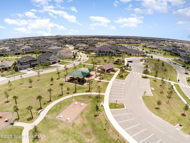 birds eye view of property with a residential view