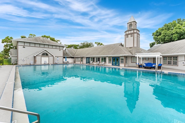 view of swimming pool with a patio area and a pergola