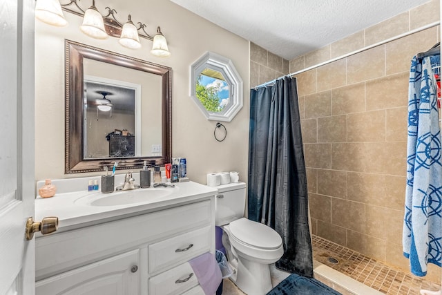 bathroom with walk in shower, toilet, vanity, and a textured ceiling